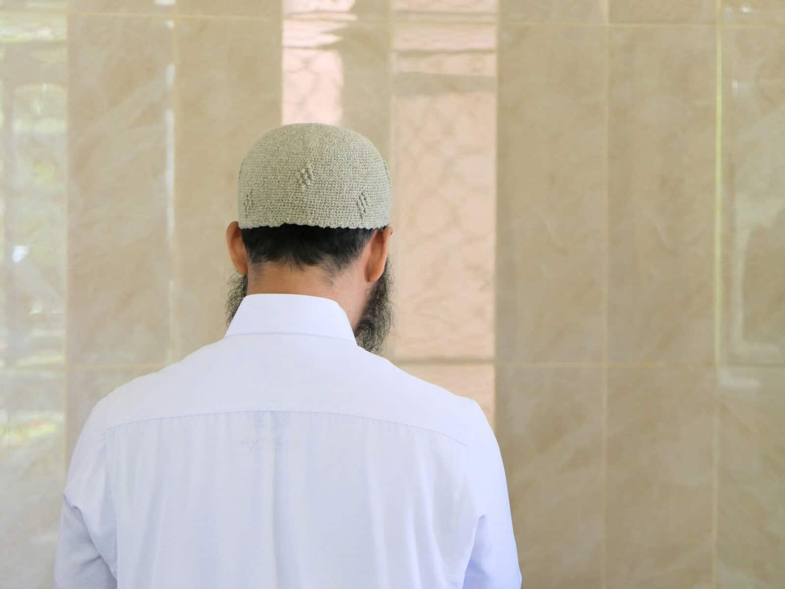 A Muslim man seen from behind.