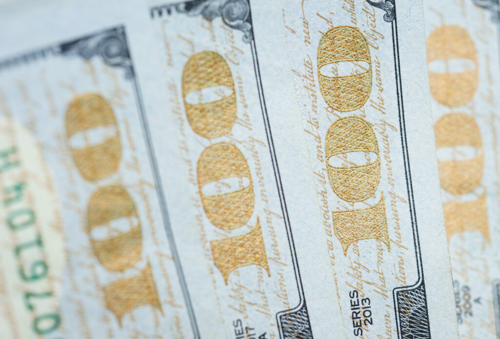 The Humility at the Heart of Childlike Faith (Matthew 18:4) Extreme close up of a 100 dollar bill in U.S. currency