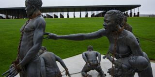 Legacy Museum bronze sculptures depicting chained men, women and children.