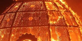 A closeup of the 'temple' at Burning Man in flames.