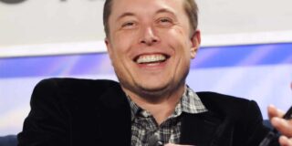 a front view of Elon Musk with a full smile