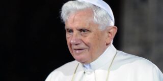 Photo shows Pope Benedict XVI in white and from the shoulders up.