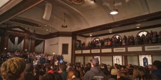 Asbury's chapel is seen from the back and crowded with people.