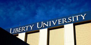 A sign for Liberty University is shown on a building.