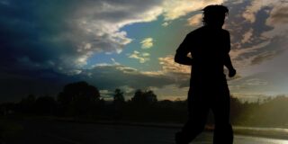 A person, possibly male, is shown in silhouette in a running posture.