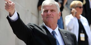 Franklin Graham is shown in a suit with an arm extended to a pointing finger.