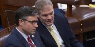 Mike Johnson is shown sitting in a congressional chamber next to and speaking with Jim Jordan.