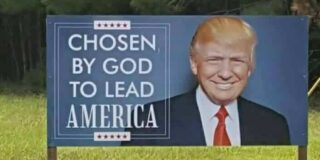 A billboard with a picture of Donald Trump that says "Chosen by God to lead America."