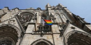 NYC Gothic church with a Pride flag in front.