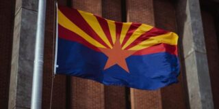 The Arizona state flag is shown.